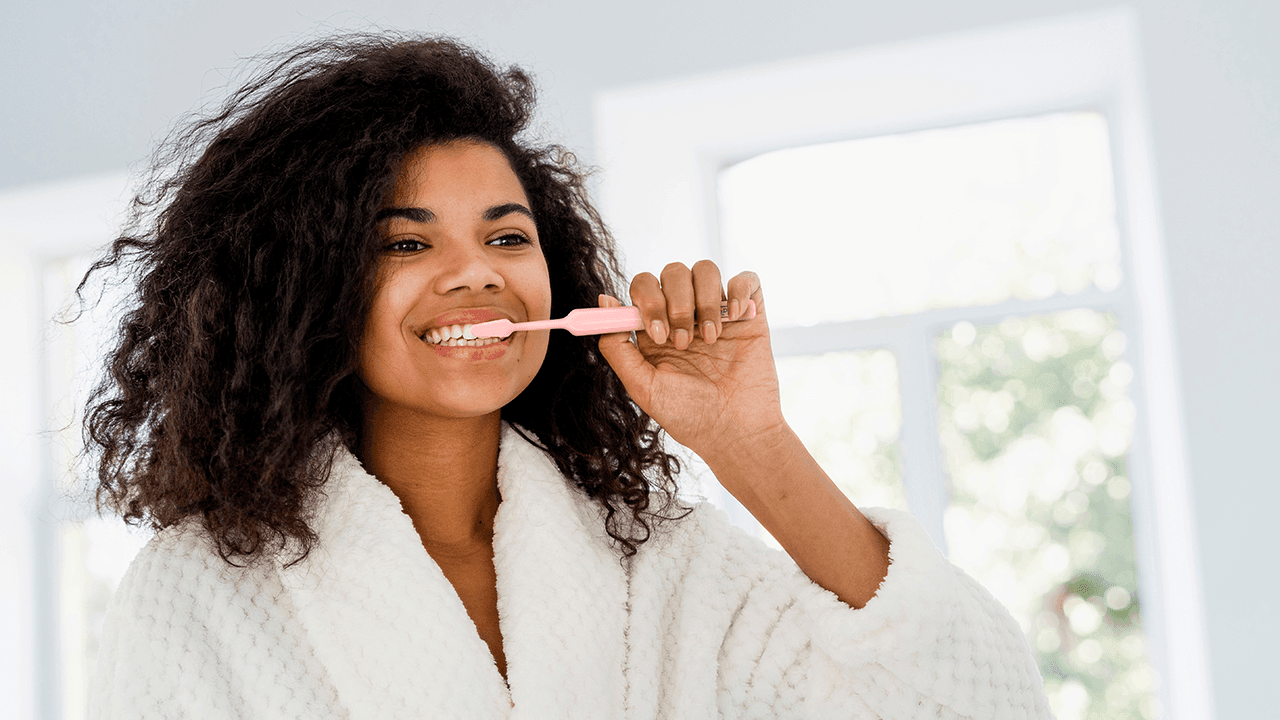woman brushing her teeth